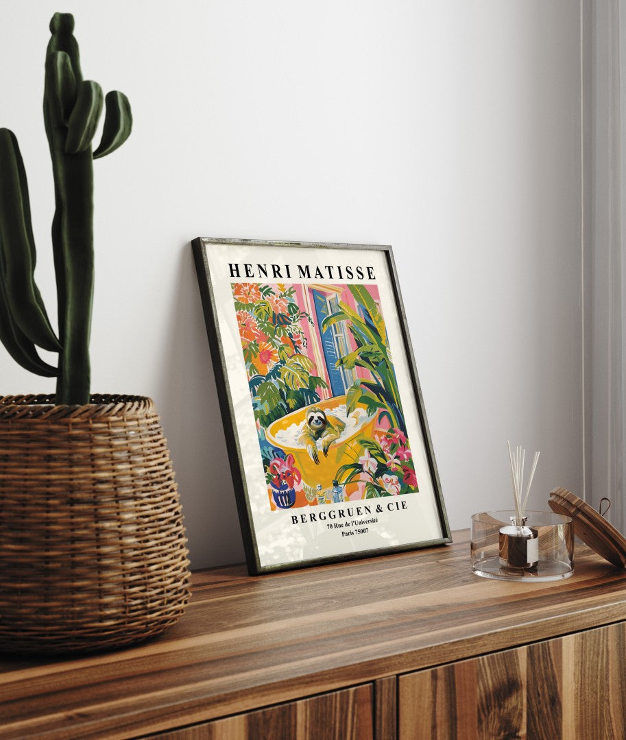 Framed Henri Matisse inspired art print of a sloth relaxing in a bubble bath surrounded by tropical greenery - decorative bathroom wall art print