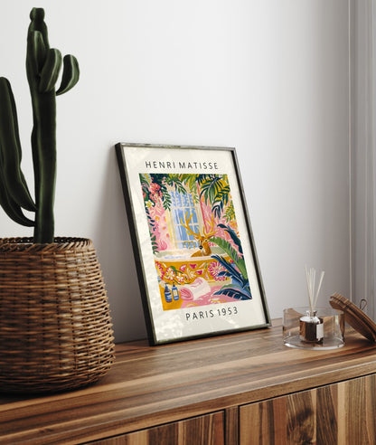 Framed Henri Matisse inspired art print of a deer lounging in a bathtub with tropical greenery - bathroom wall art print for decor