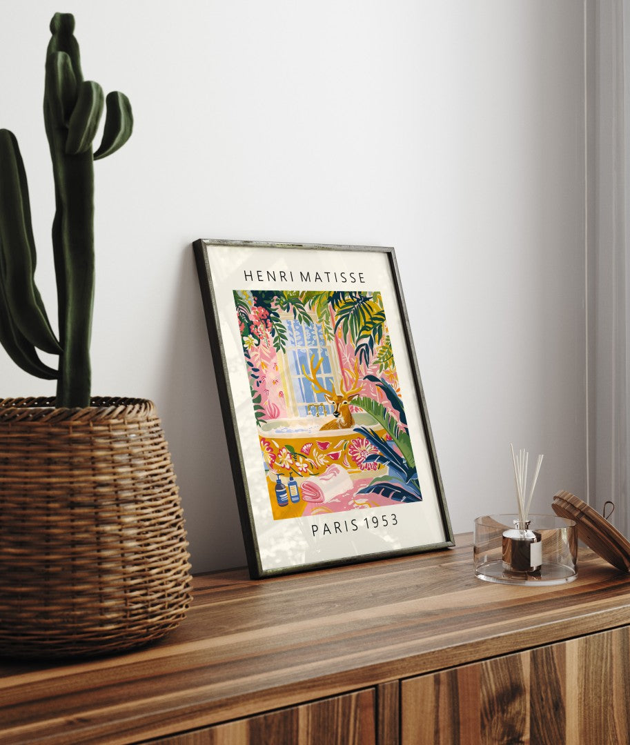 Framed Henri Matisse inspired art print of a deer lounging in a bathtub with tropical greenery - bathroom wall art print for decor