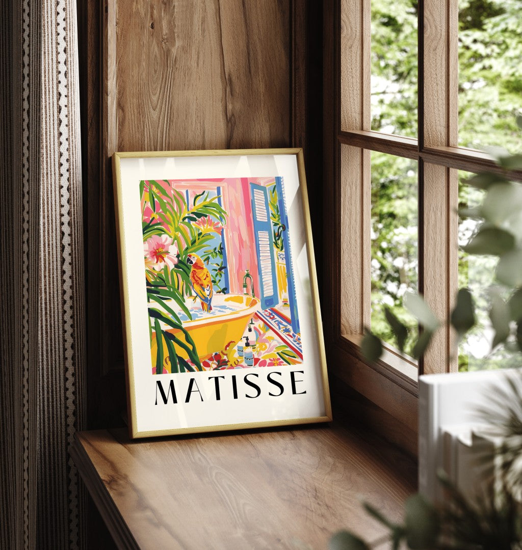 Framed Henri Matisse inspired print of a vibrant parrot in a tropical bathroom scene with lush greenery and a yellow bathtub.