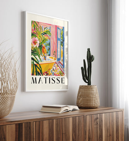 Framed tropical bathroom wall art featuring a colorful parrot in a yellow tub, inspired by Henri Matisse’s lively style.