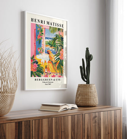 Framed tropical bathroom wall art of a bright parrot perched on a yellow tub, inspired by Matisse’s vivid style.