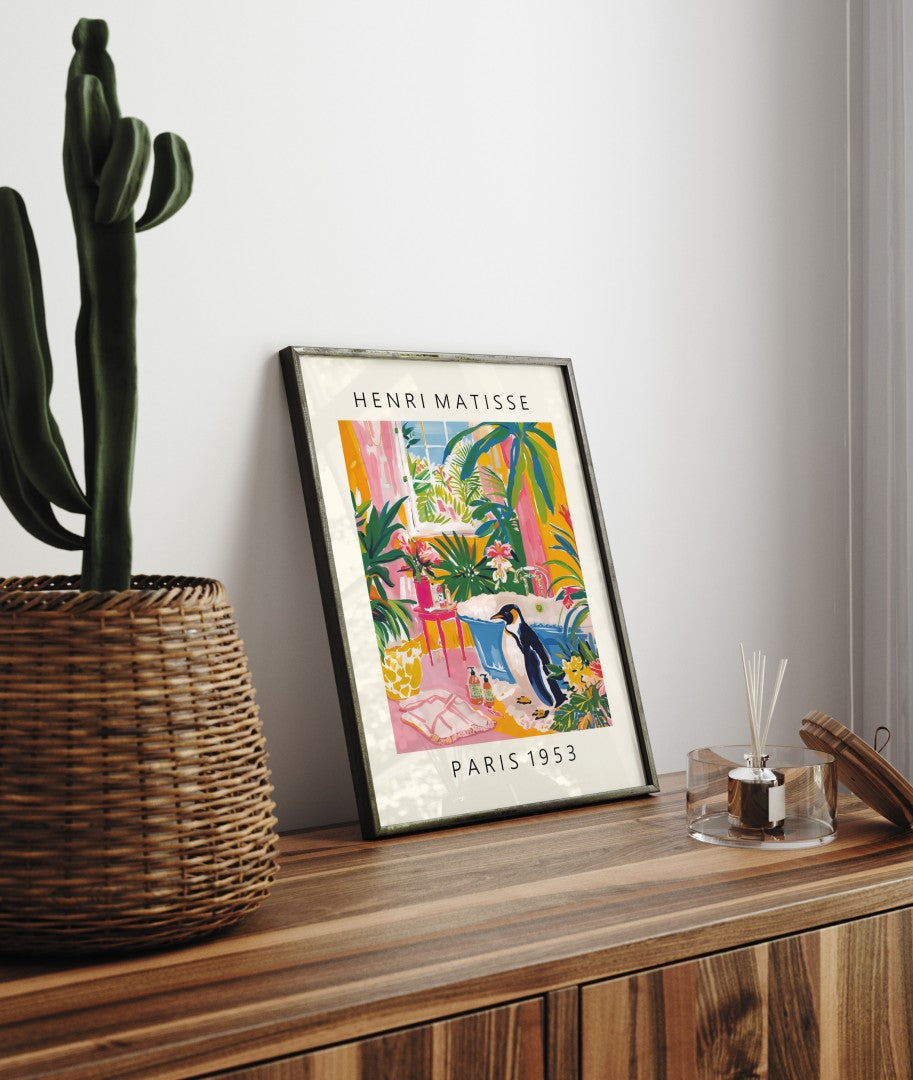 Framed Matisse inspired bathroom print featuring a penguin and vibrant tropical foliage.