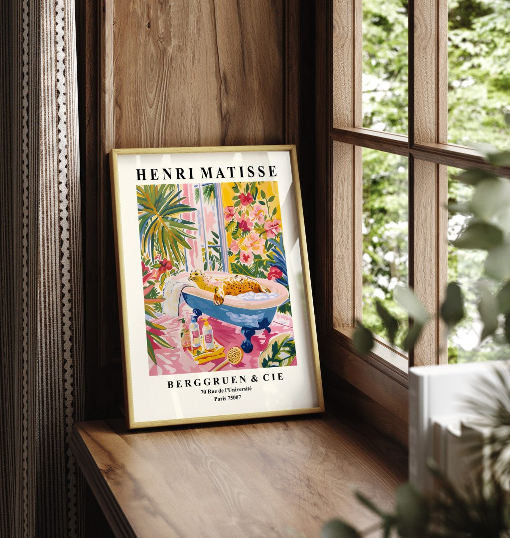 Framed bathroom artwork featuring a seal relaxing in a tub surrounded by colorful flowers.