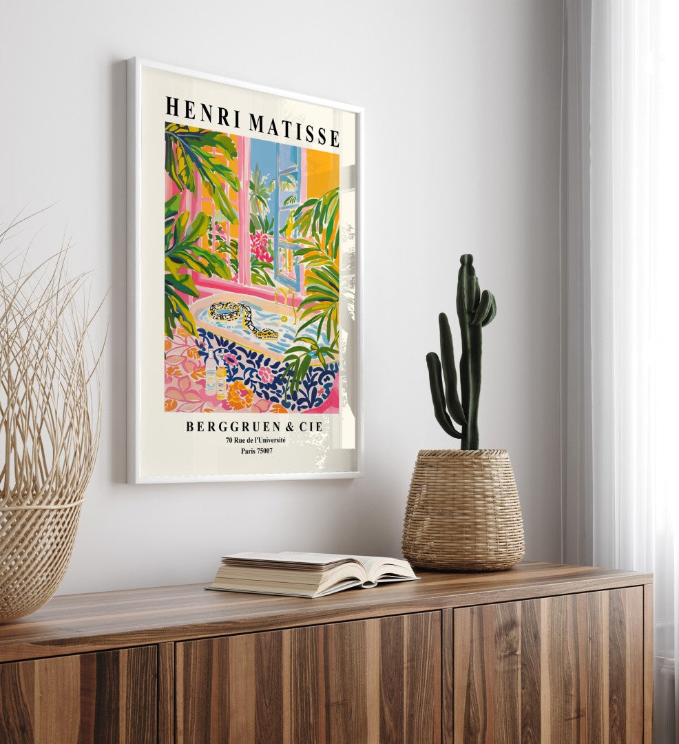 Henri Matisse inspired wall art of a snake in a tub framed by vibrant flowers and leaves.