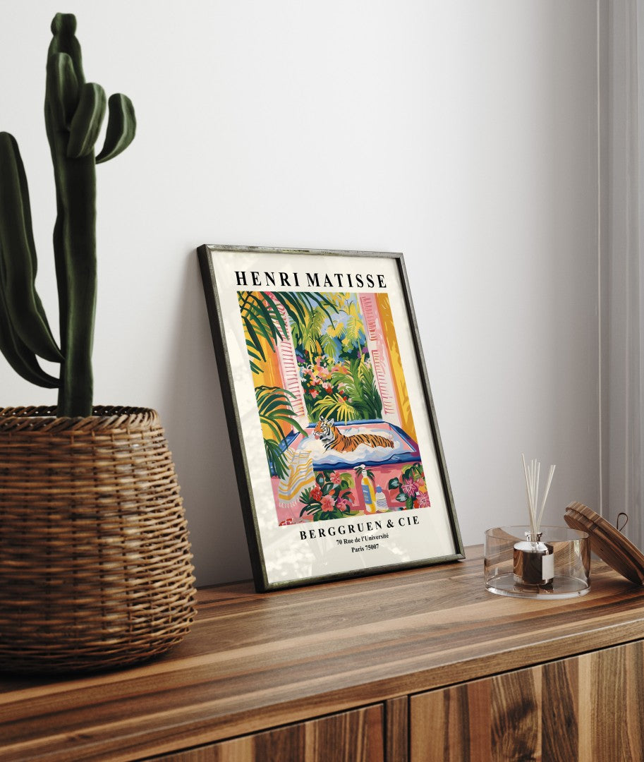 Framed bathroom art print of tiger in bathtub surrounded by bold tropical colors in Matisse style