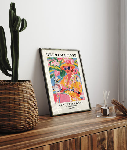 Modern Matisse style wall art of a woman on a Vespa surrounded by bold florals