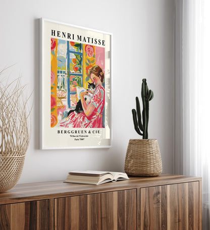 Colorful Matisse-style framed print of a woman and cat.