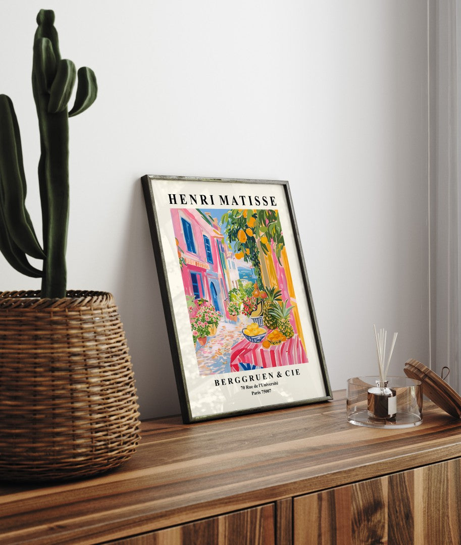 Framed seaside art print of Mediterranean street with fruit stall and bold Matisse colors