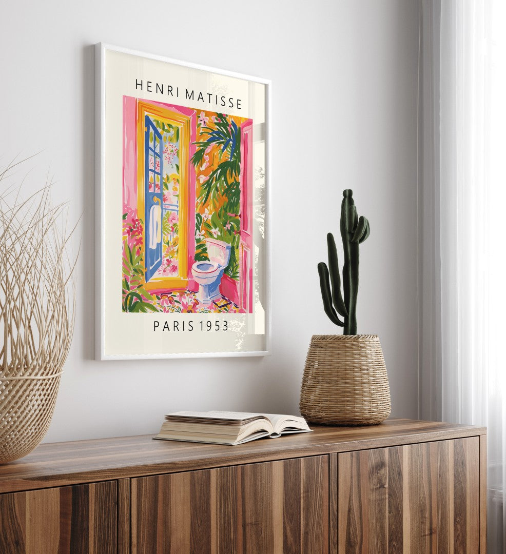Framed Matisse style tropical bathroom wall art with toilet and vibrant plants.