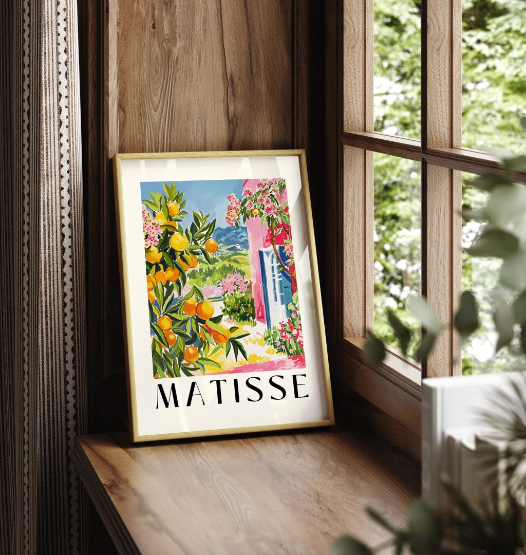 Framed art print showing Mediterranean villa with orange tree and flowers