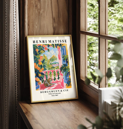 Framed leopard art print in Matisse style with balcony and orange trees