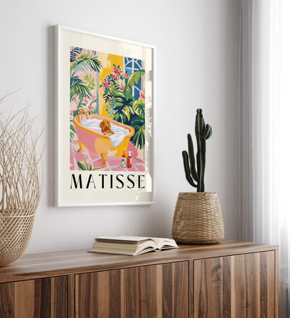 Framed Matisse style tropical bathroom art with dachshund and lush greenery.