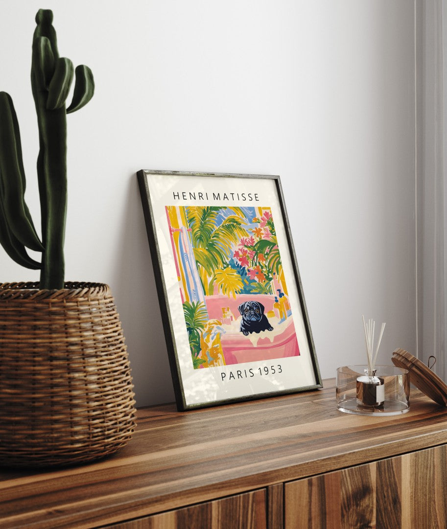 Framed tropical bathroom print featuring a black pug in a bubbly pink tub.