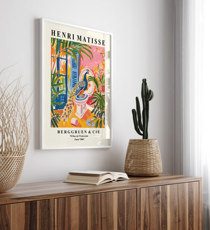 Tropical-themed bathroom wall art featuring a peacock and bold greenery.