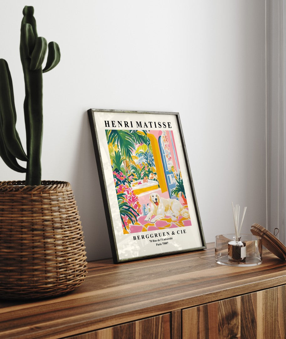 Framed wall art of a Great Pyrenees surrounded by flowers and tropical greenery.