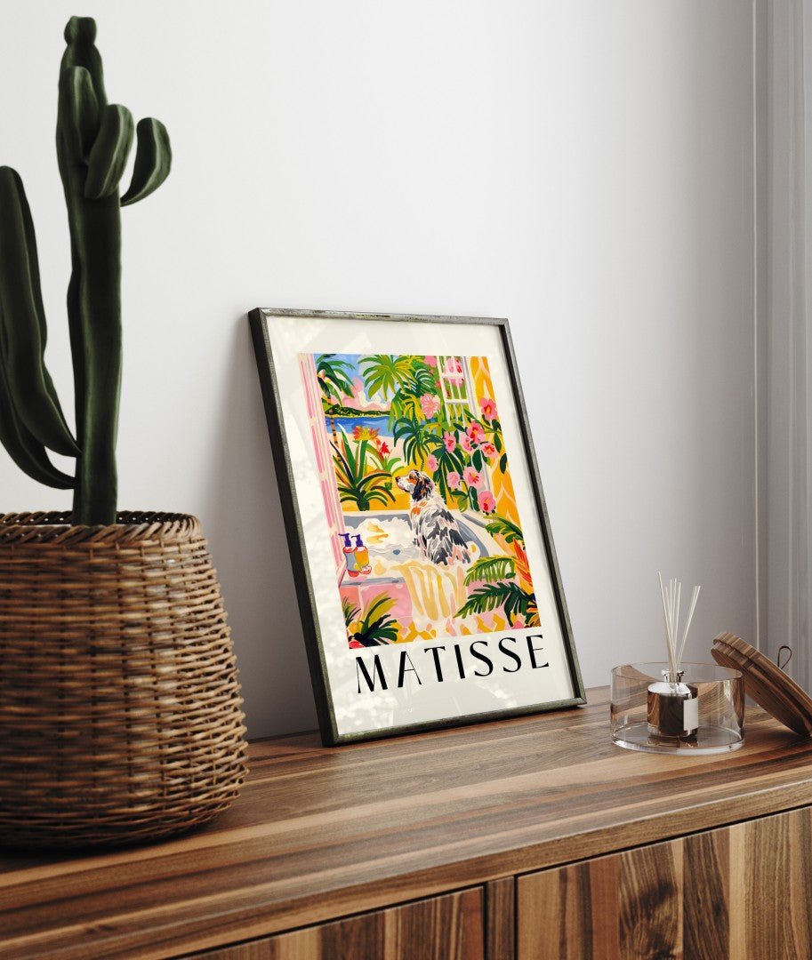 Framed artwork of an Australian Shepherd in a bright, plant-filled bathroom with an ocean view.
