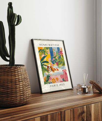 Framed artwork featuring a Cavalier King Charles Spaniel and tropical floral décor.
