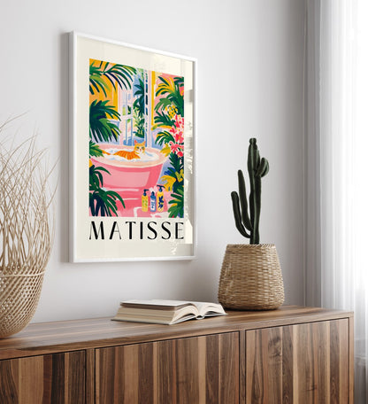 Bright wall art featuring an orange cat in a pink tub with greenery and flowers.