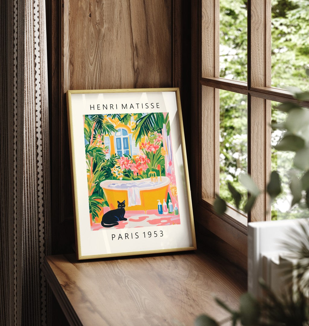 Framed black cat art print with colorful greenery and bathroom scene.