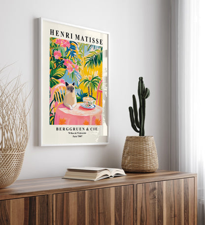 Playful framed art print of Siamese cat at café table with latte art