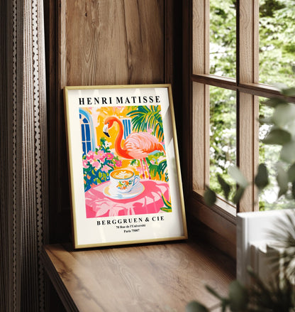 Framed flamingo art print with coffee cup and tropical plants in Matisse style