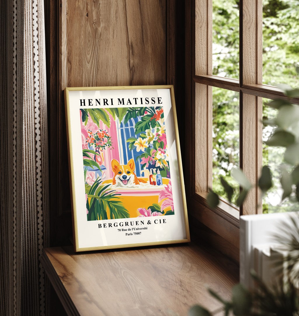 Framed wall art of a Corgi relaxing in a colorful Matisse-style bathroom.
