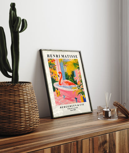 Flamingo in a bathtub, framed art print with vibrant botanical details.