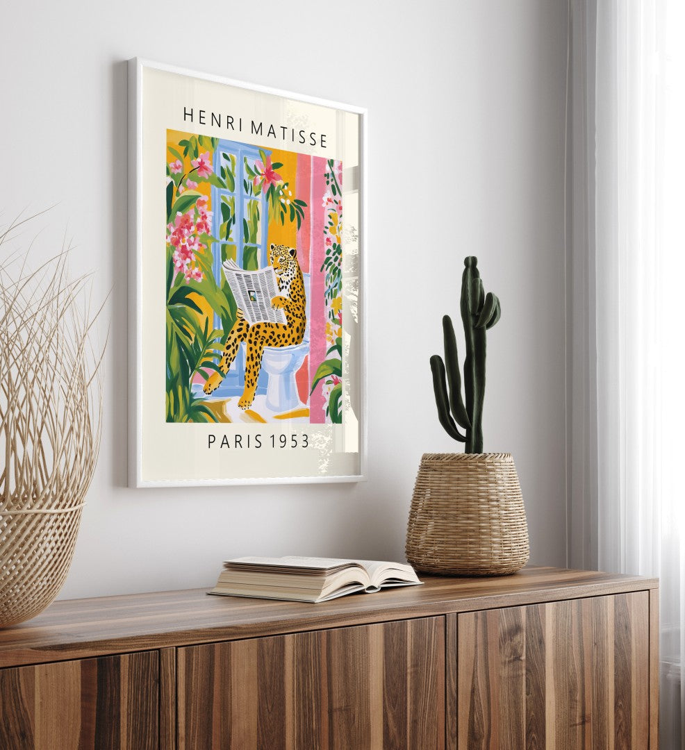 Matisse inspired framed bathroom artwork of leopard reading in lush setting