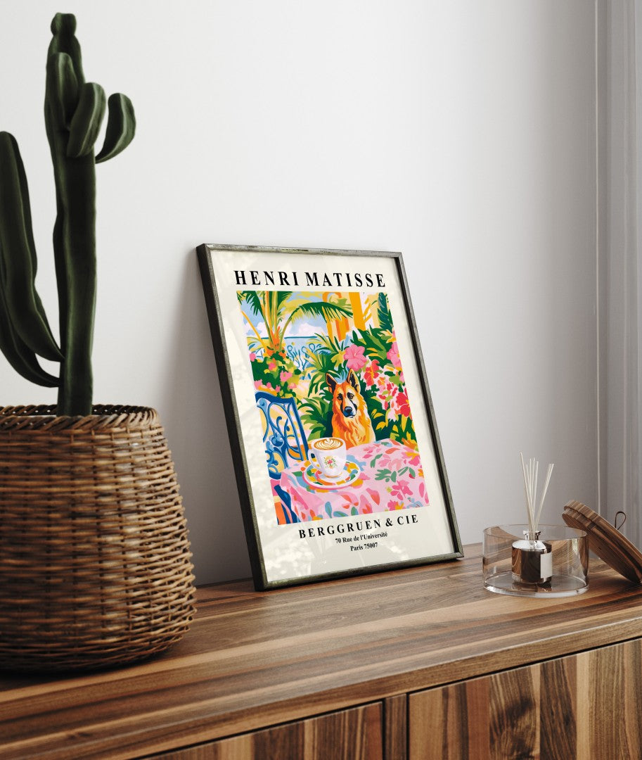 Framed art print showing a German Shepherd coffee scene among tropical flowers and lush foliage in Matisse inspired design