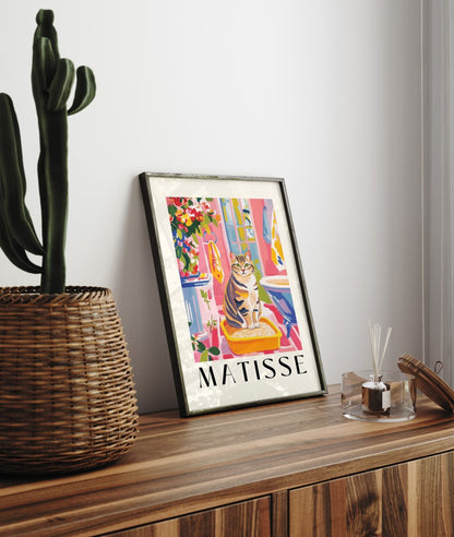 Playful framed wall art for bathroom featuring tabby cat