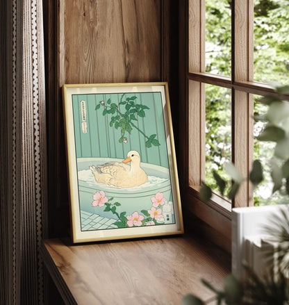 Framed bathroom wall art featuring a duck in a peaceful floral Japanese bath