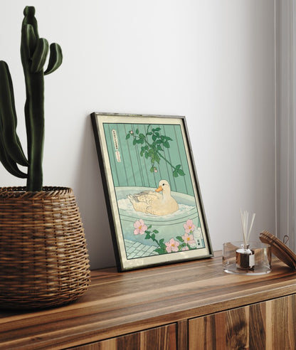 Framed bathroom decor print showing a serene duck in a traditional Japanese-style bath