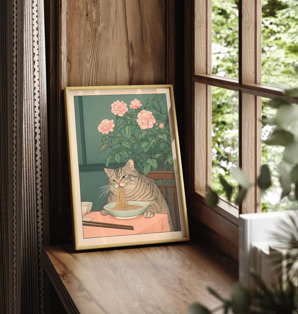 Framed cat bathroom print featuring a tabby eating ramen in a cozy scene