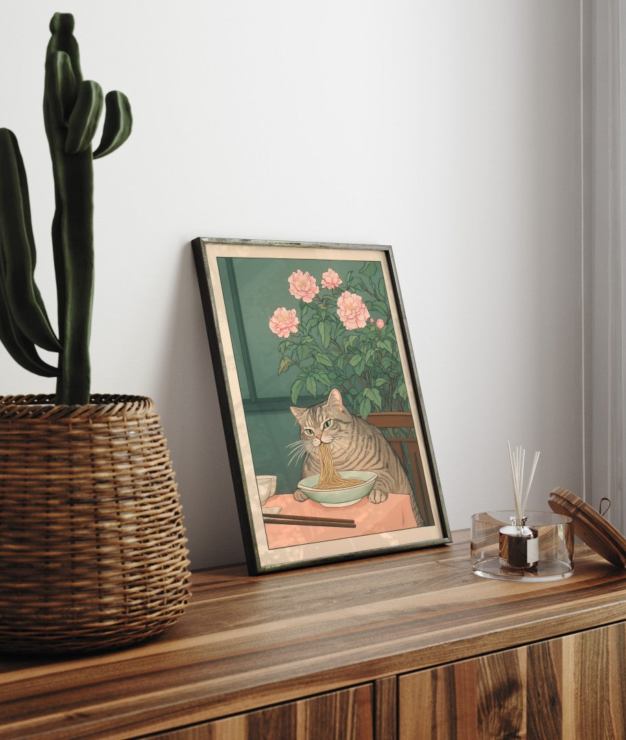 Framed bathroom decor showing a happy cat slurping noodles in Japanese style