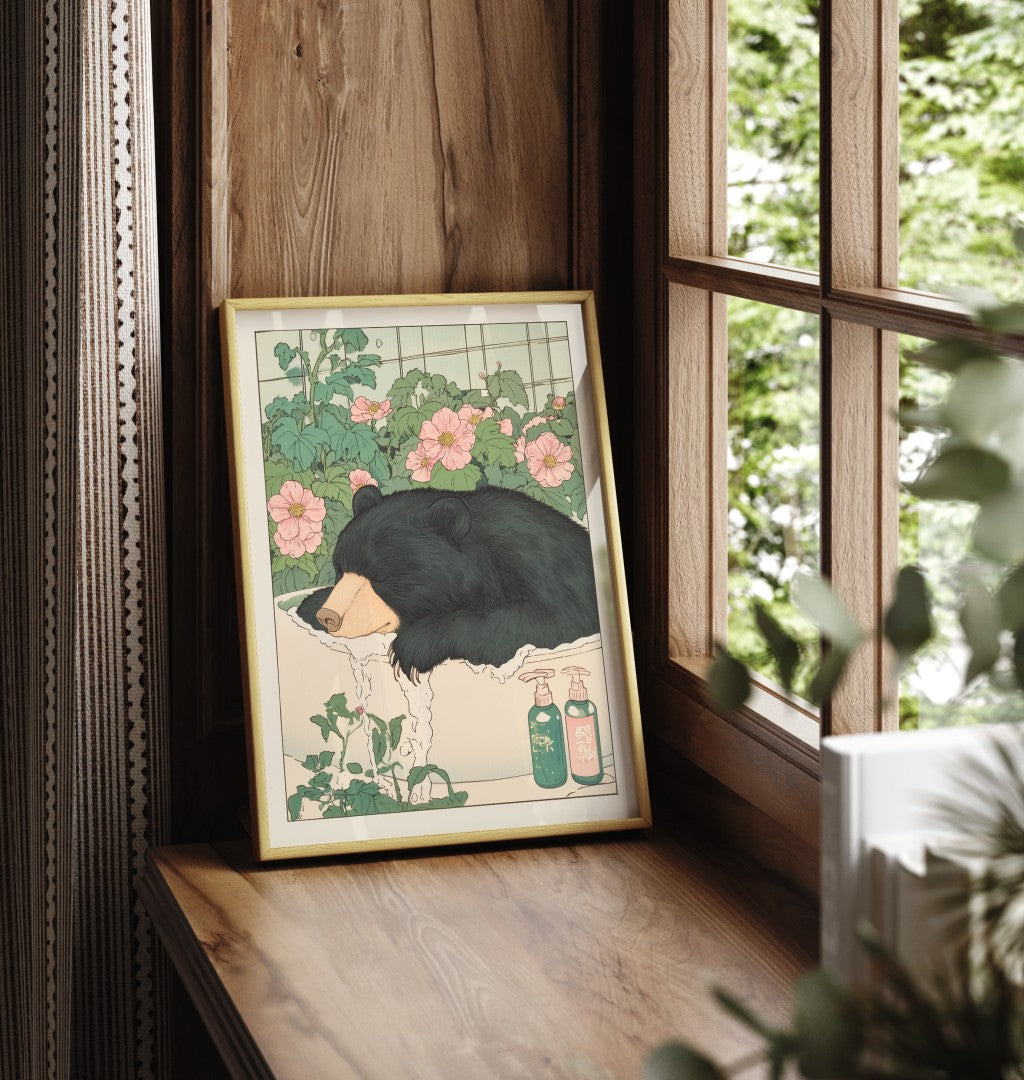 Framed bathroom decor featuring a relaxed black bear in a soft floral soak