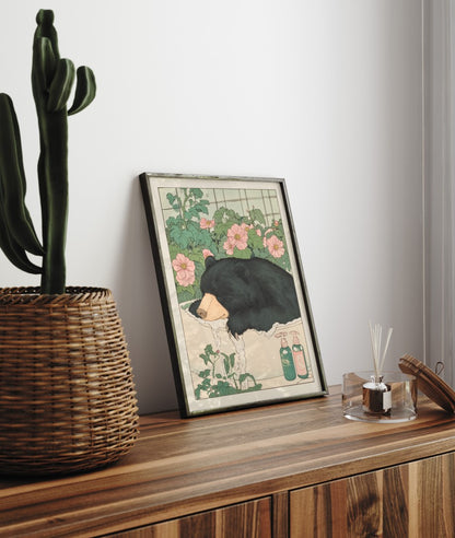 Framed bathroom wall art with a calm black bear surrounded by blossoms