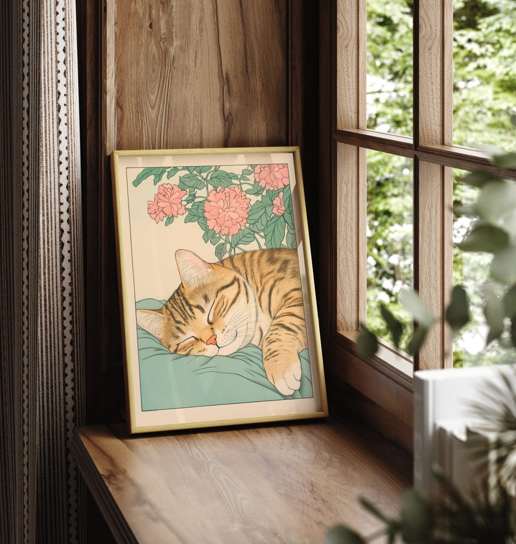 Framed cat print featuring a sleeping tabby surrounded by blooming chrysanthemums