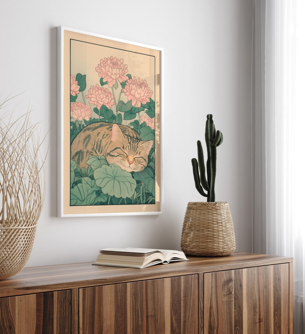 Calm cat print featuring a tabby curled up in a garden of large green leaves and blooming pink flowers