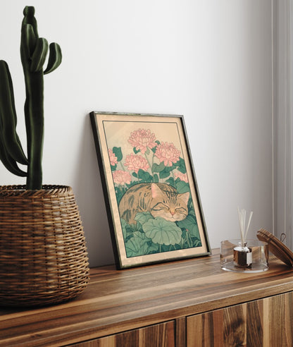 Botanical-themed wall art of a sleeping cat resting beneath pink chrysanthemum flowers