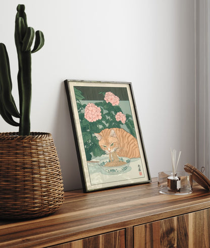 Whimsical cat print featuring a ginger tabby eating noodles beside pink flowers