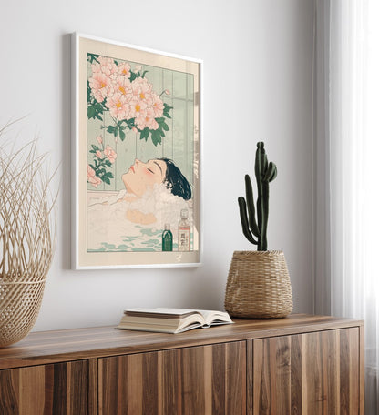 High-quality framed bathroom wall art with woman soaking under soft pastel florals