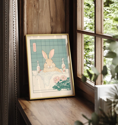 Framed bathroom print of bunny soaking in tub with soap bottles and blossoms