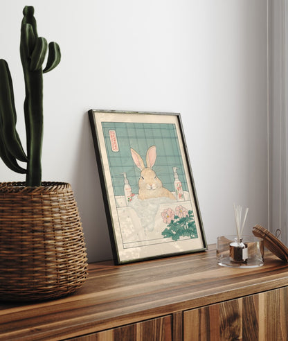 Framed bathroom decor showing a relaxed bunny in a Japanese-style tiled bath