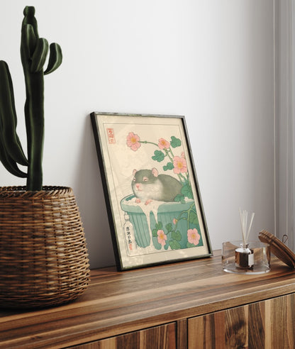 Framed bathroom decor showing a peaceful rat resting in a floral soak