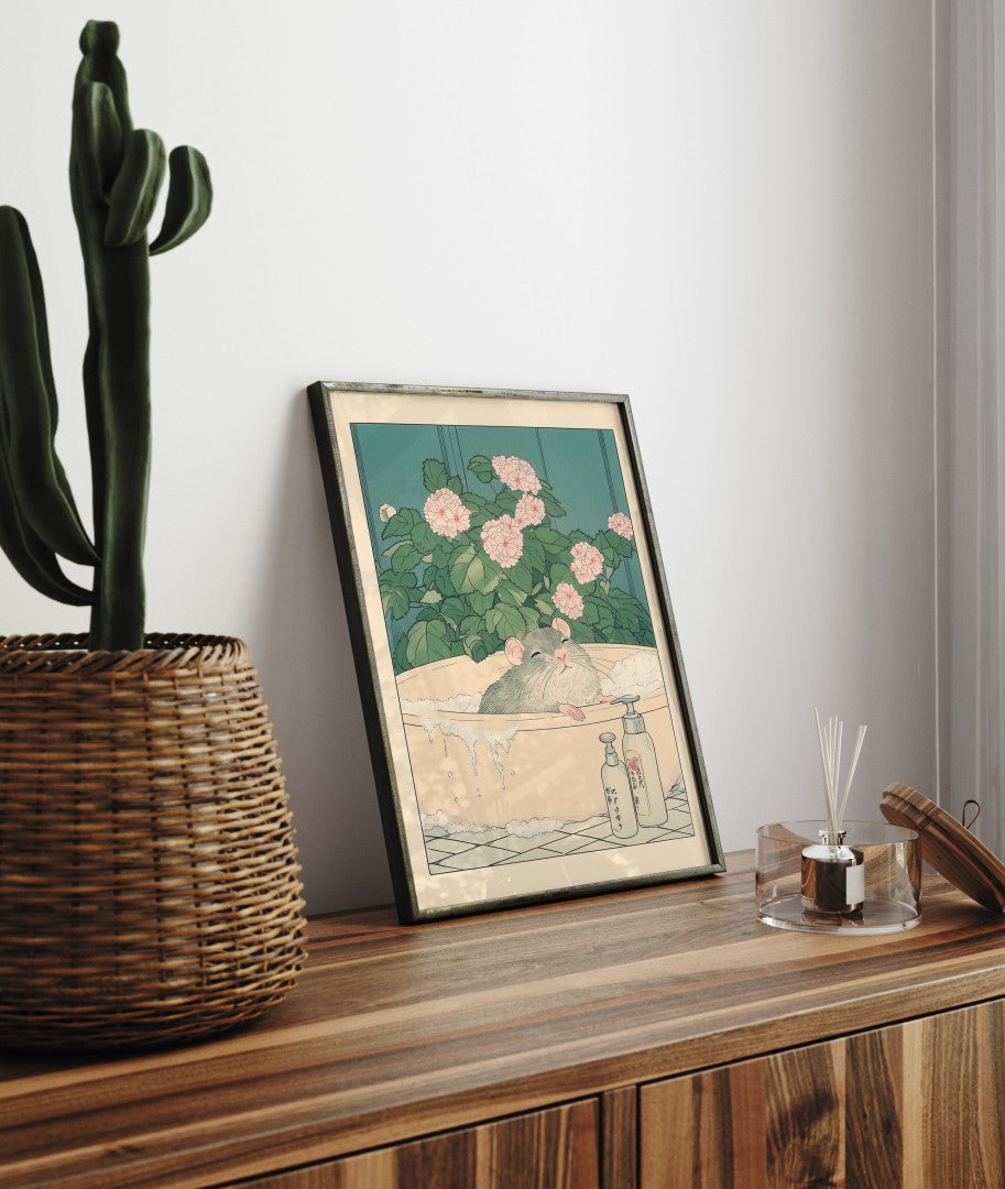 Framed bathroom decor showing a peaceful rat resting in a flower-filled soak