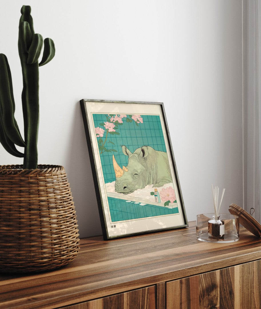 Framed bathroom decor showing a calm rhinoceros resting in a tiled floral bath