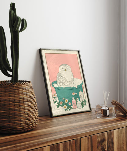 Framed bathroom decor showing a peaceful snowy owl in a Japanese-style floral soak