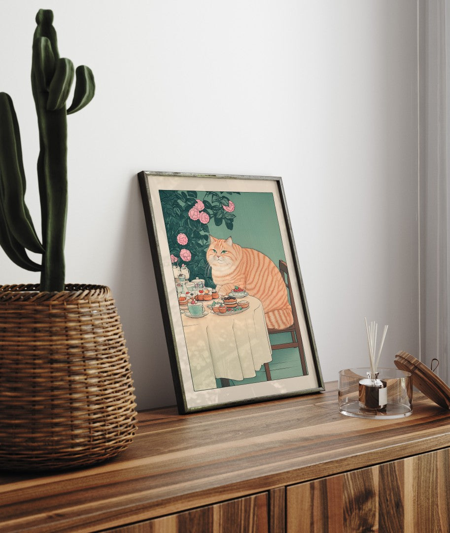 Orange cat seated at a round table with cupcakes and coffee