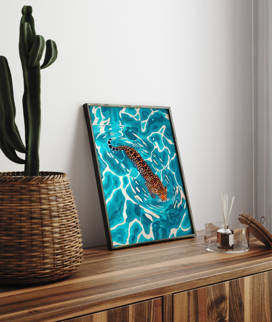 Framed art print of jaguar swimming gracefully through vivid turquoise water